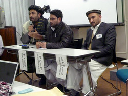 発表者・左からサビルラ・メムラワルさん（治安・総務担当）、アブドゥル・ワハーブさん（地域保健医療担当）、モハメッド・シャプール・サフィさん（診療所運営担当）