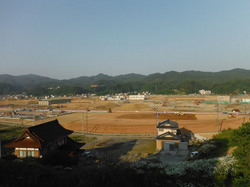 かさ上げ工事が進む鹿折地区の市街地